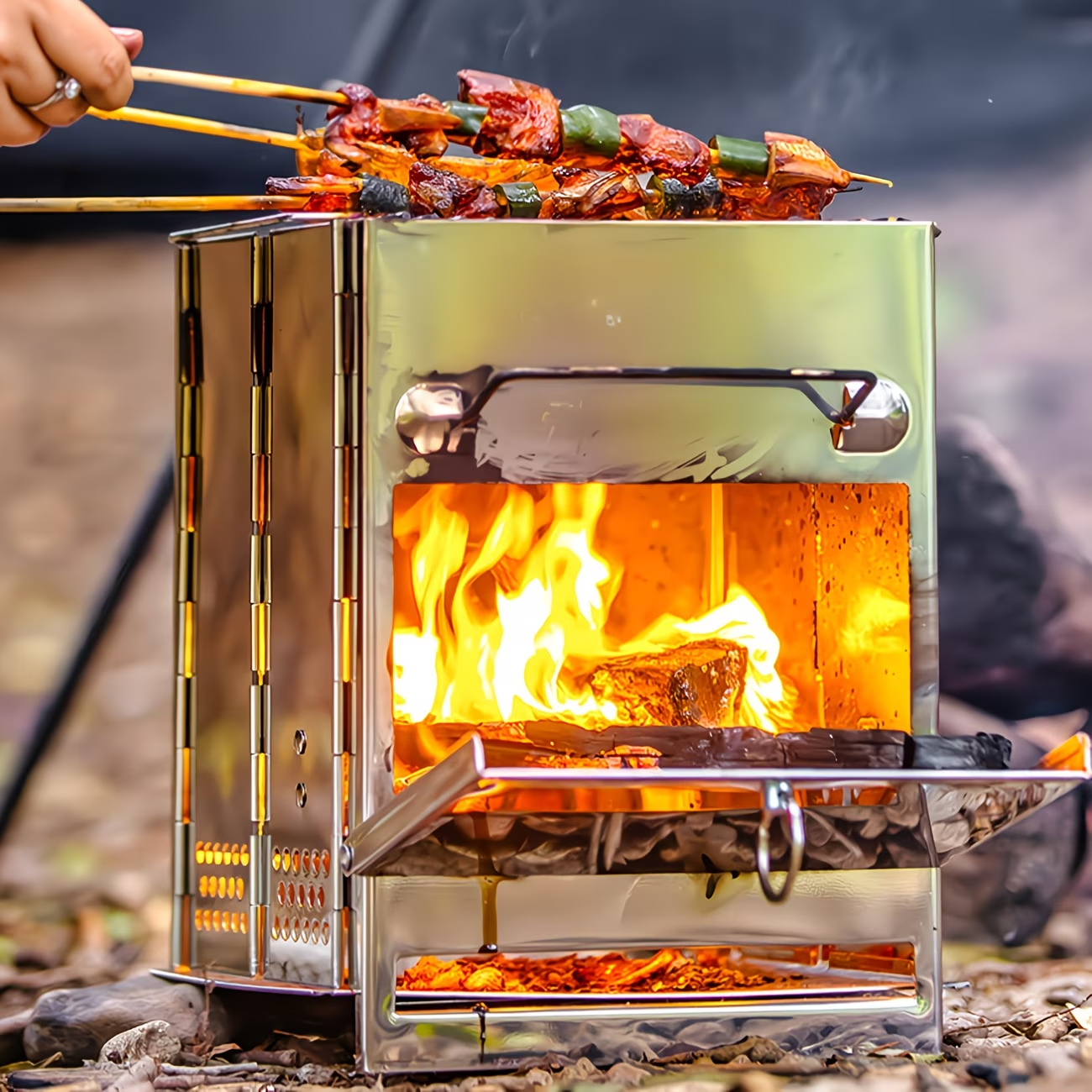 Compact Wood-Burning Camp Stove with Folding Panel Body, Grill Rack, Blowpipe and Storage Bag in Silver Tone