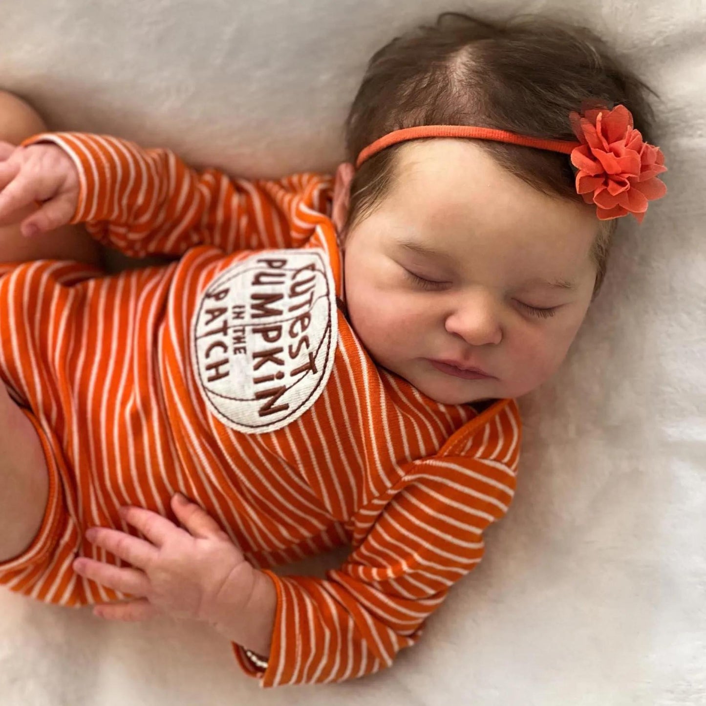Reborn Baby Doll 20-Inch Sleeping Cloth Body with Rooted Hair, Orange Outfit, Pacifier, Bottle and Accessory Card