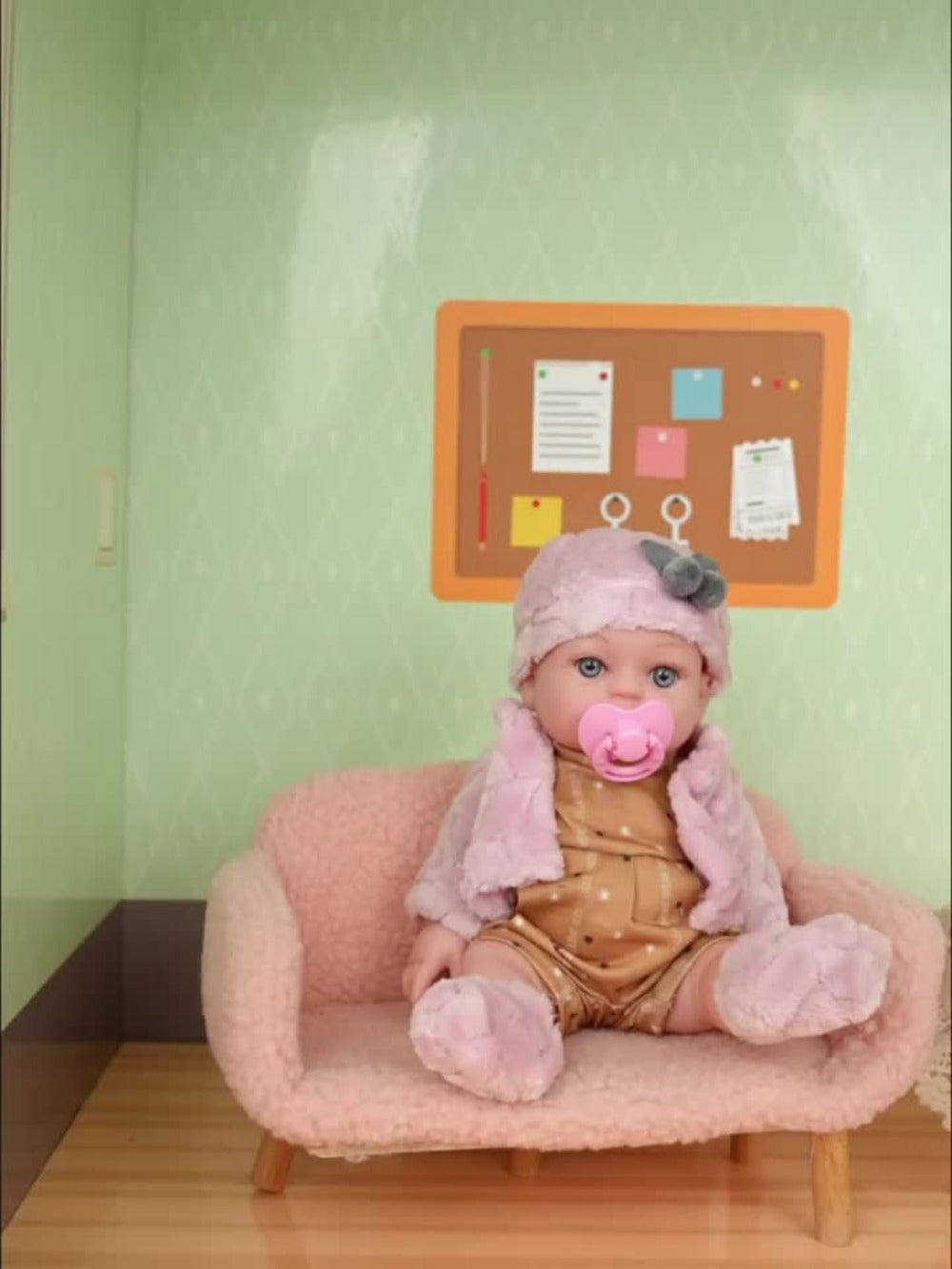 Pink Baby Doll with Open-Eye Face, Pacifier and Textured Outfit Across Three Checkout Style Labels
