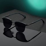 Dark green frame with black and grey lenses