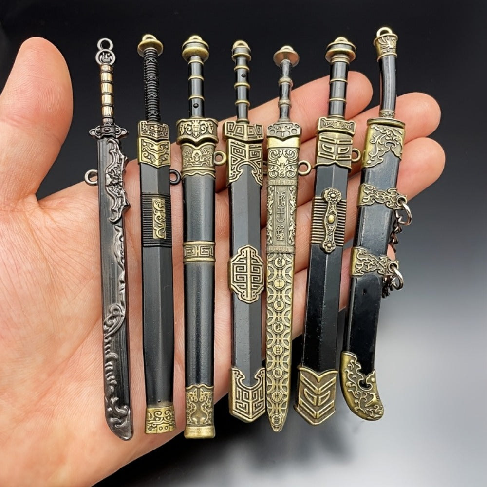 Seven-Piece Miniature Metal Sword Replica Set with Sheaths, Keychains and Ancient-Inspired Display Designs