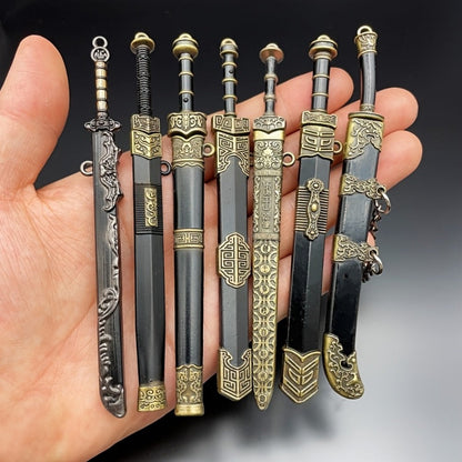 Seven-Piece Miniature Metal Sword Replica Set with Sheaths, Keychains and Ancient-Inspired Display Designs