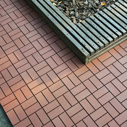 Gray 44-Piece Interlocking Deck Tile Set with 12-Inch Square Brick-Block Surface Pattern Pictured