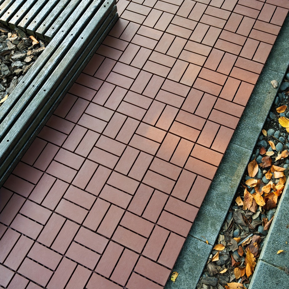 Gray 44-Piece Interlocking Deck Tile Set with 12-Inch Square Brick-Block Surface Pattern Pictured