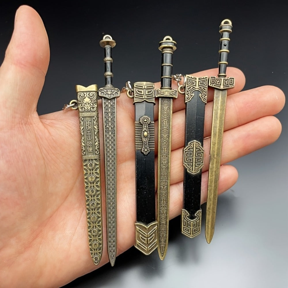 Seven-Piece Miniature Metal Sword Replica Set with Sheaths, Keychains and Ancient-Inspired Display Designs