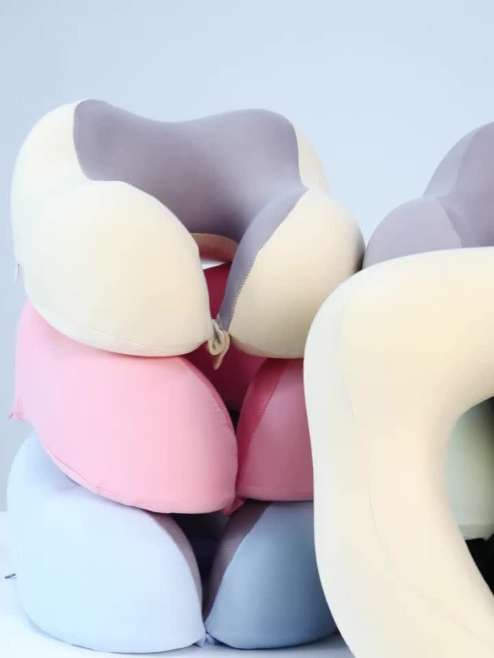 Rollable Memory Foam Travel Neck Pillow with Round Storage Case in Beige, Black or Pink-and-Gray Color Block